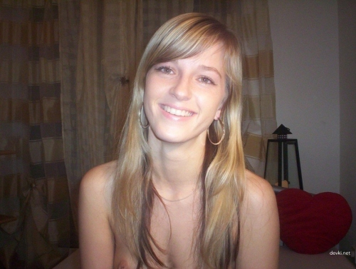 Hot young babe poses naked and rides pussy on bottle in explicit solo action