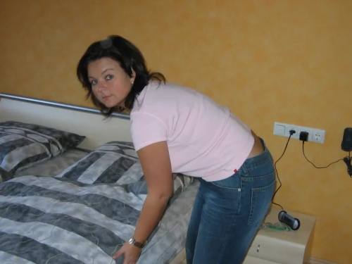 Seductive mature wife teases husband with provocative poses