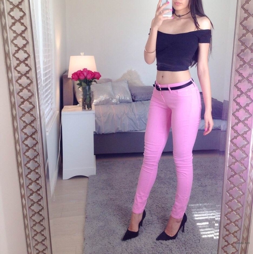 Seductive Girl in Pink Jeans: Stunning Beauty in Provocative Pose