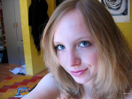 Seductive Friend Poses in Stockings on Bed: Explicit Bedroom Photoshoot