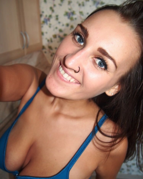 Brunette squeezes big tits for hot naked selfies