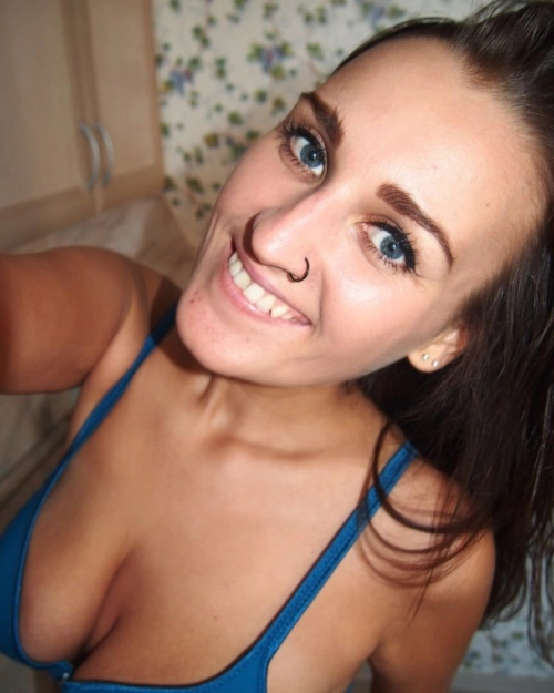 Brunette squeezes big tits for hot naked selfies