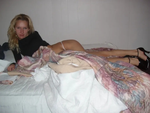 Slender babe with beautiful breasts shows off her pussy