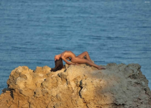 Sexy Brunette Poses Seductively in Various Photos - Explicit Content