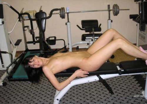 Naked Brunette in Gym: Explicit Nude Workout Session