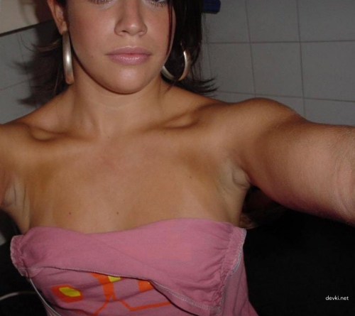 Girl Exposes Breasts: Explicit Photo