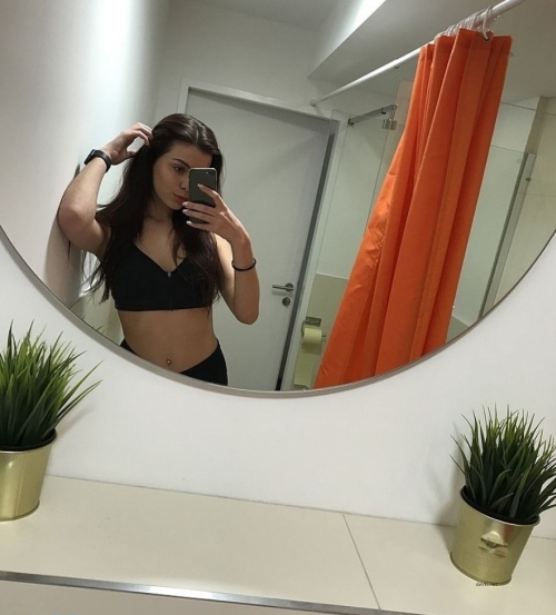 Bored Beauty's Explicit Selfie: Sultry Pose for Attention