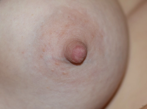 Super Busty Blonde Seductively Flaunts Her Assets in Revealing Top