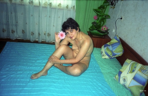 Naked Lighter: Explicit Nude Woman with Fire in Provocative Pose