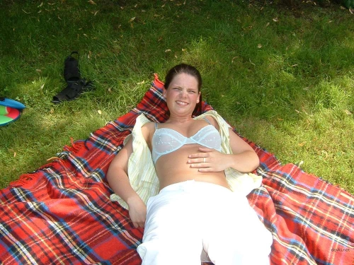 Naked Girl Relaxing: Explicit Nude Woman Sunbathing on Beach