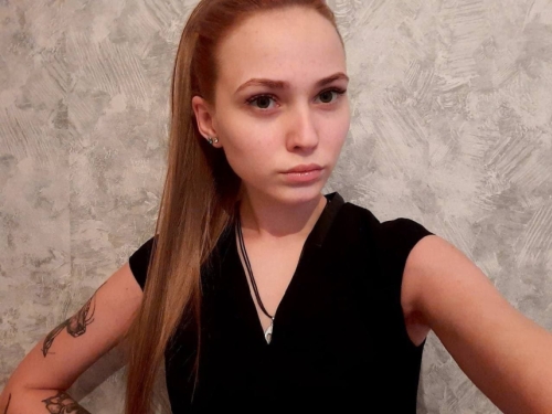 Exposed Tattooed Girl Flaunts Naked Body in Provocative Pose