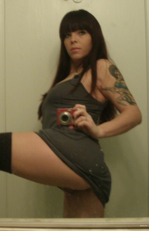 Naked girl takes explicit selfie: Hot young woman in provocative pose