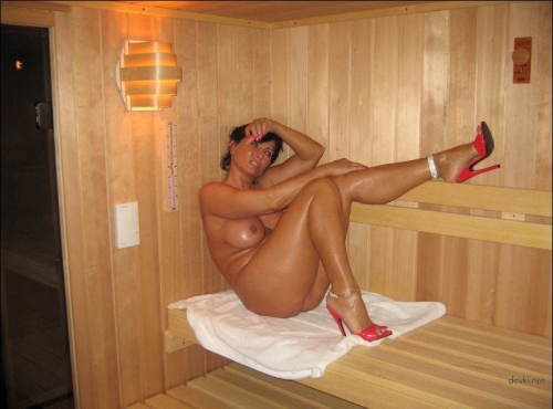 Mature Woman in Sauna: Hot and Steamy MILF Enjoying a Steamy Session