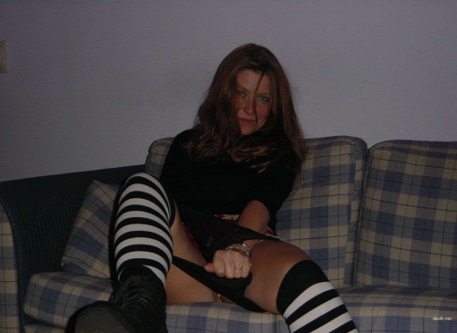 Fiery Redhead Flaunts Her Shaved Pussy