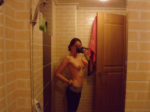 Selfie Mirror Photo: Bold and Explicit Self-Portrait Captured in Mirror