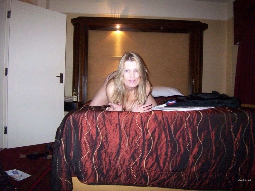 Hot MILF pleasuring herself with a dildo