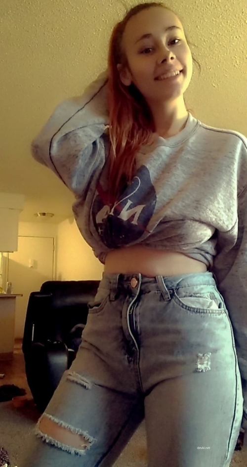 Busty Smiling Beauty: Explicit Seduction in Provocative Pose