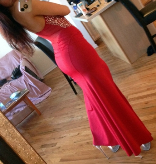 Sexy Busty Beauty in Red Dress - Seductive Cleavage and Curves