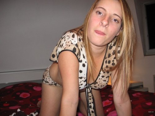 Seductive Young Woman Poses Erotically in Provocative Photoshoot