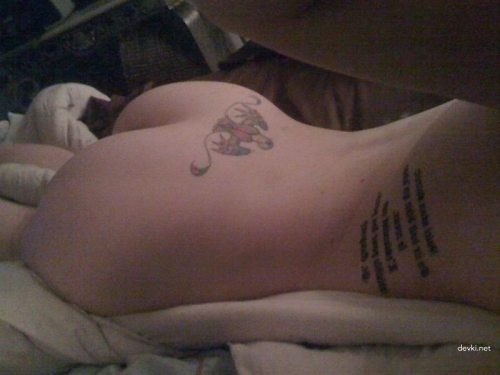 Naked Girl with Lower Back Tattoo Exposed: Explicit Photo
