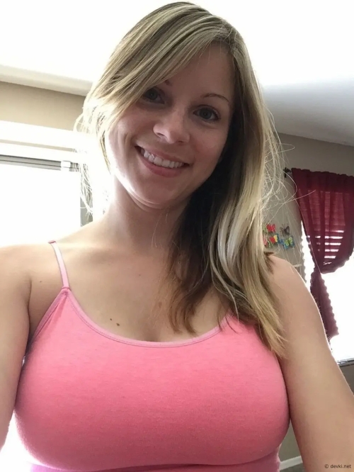 Hot Blonde with Gorgeous Natural Tits Smiling Seductively