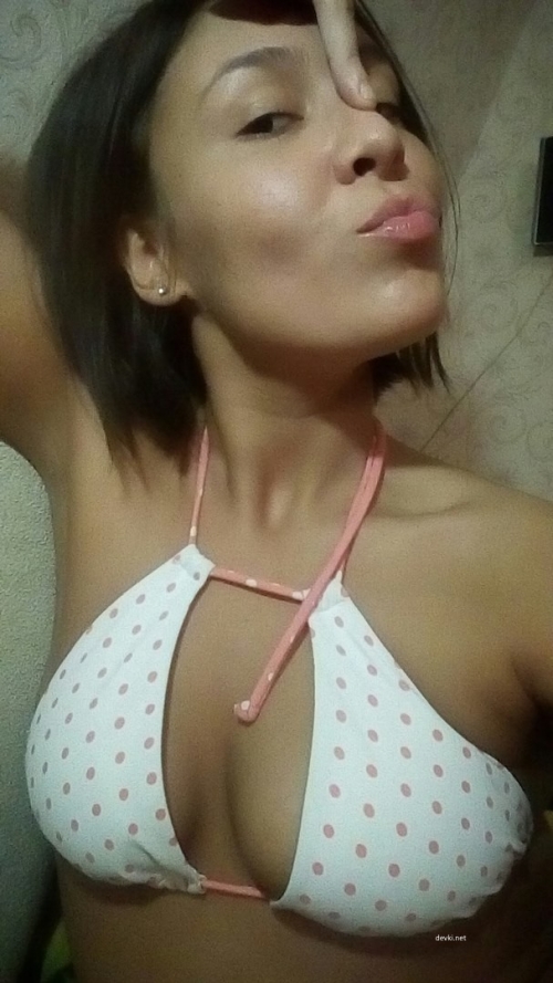 Girl flaunting boobs: Explicit and bold photo for adult content seekers
