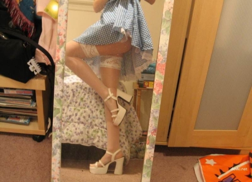 Sexy Schoolgirl in Short Skirt: Seductive Teen Girl Poses in Provocative Outfit
